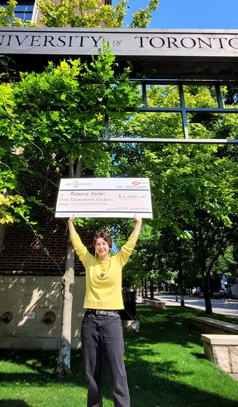 2023-24 VTO Scholarship winner, Rebecca Forler holds her US$1,0000 cheque.